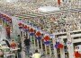 Workers push carts full of merchandise at the Amazon.com Phoenix Fulfillment Center in 2010.